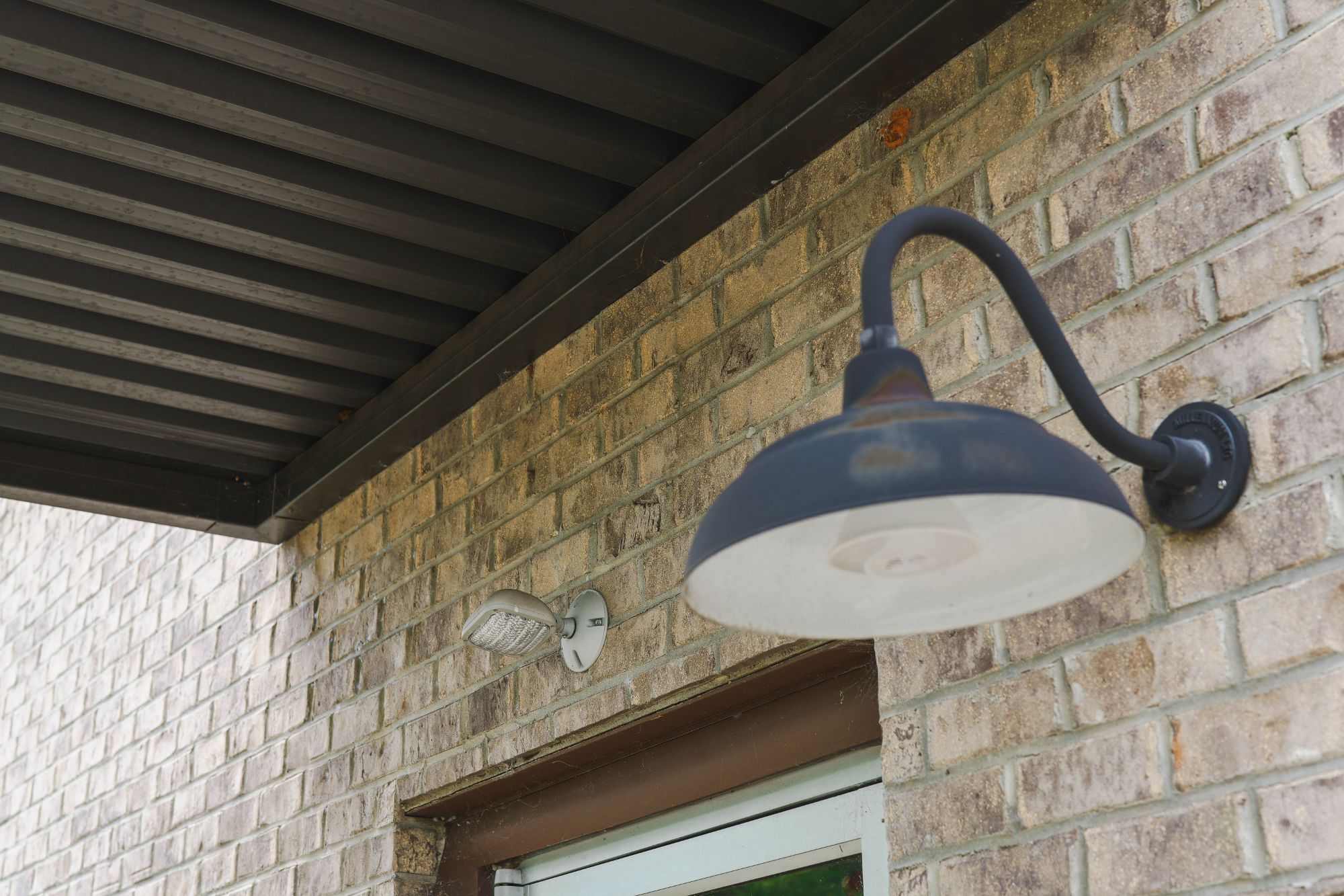 Gooseneck exterior lamp above the entrance of Integrative Health Partners clinic at 319 Wade Hampton Blvd, Greenville SC