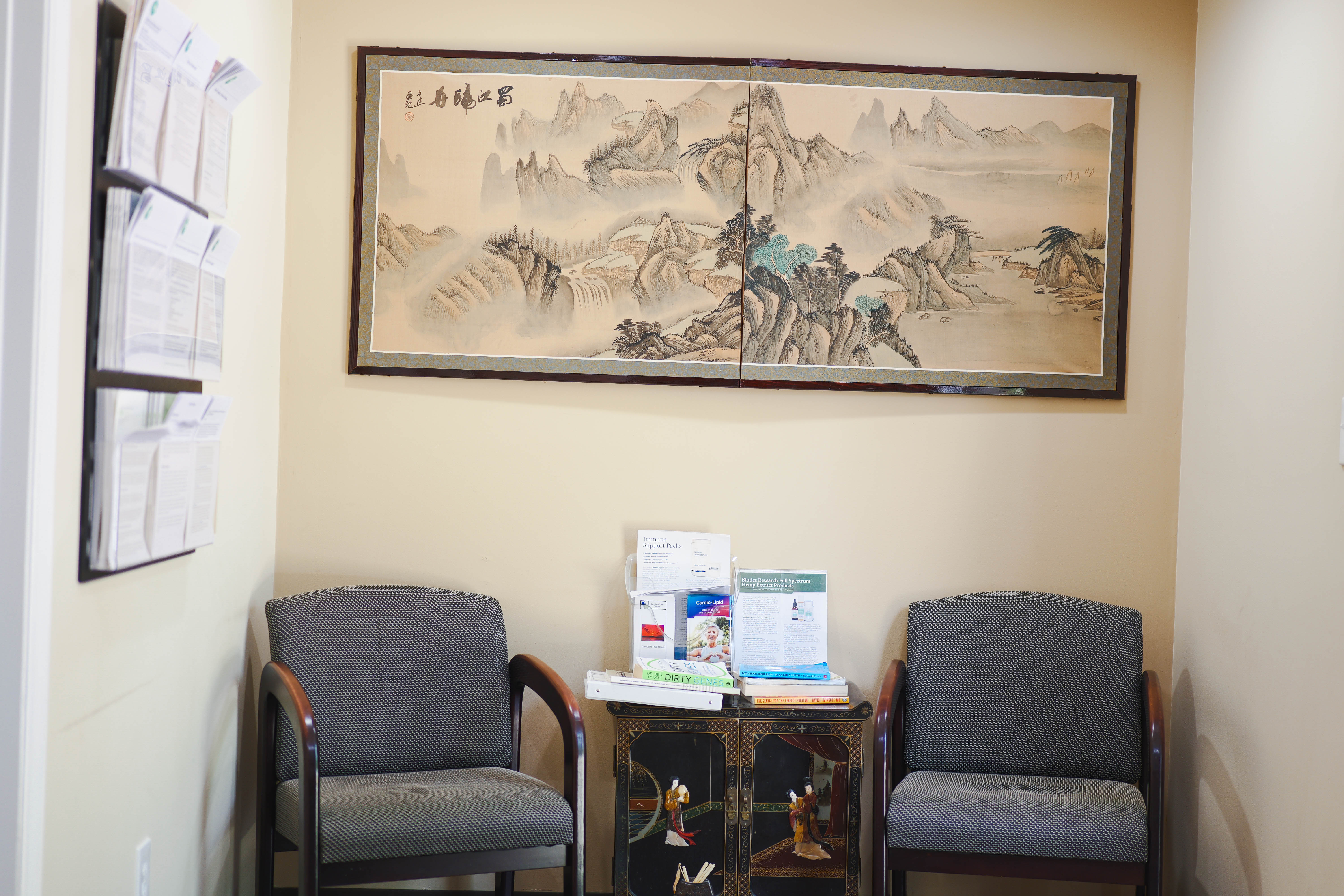 Waiting area at Integrative Health Partners — comfortable and decorated with traditional Chinese landscape art